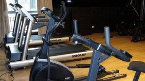 A gym with multiple treadmills, each labeled 'SINOBO A50'. - Intl Talent City Hotel (Shanghai)