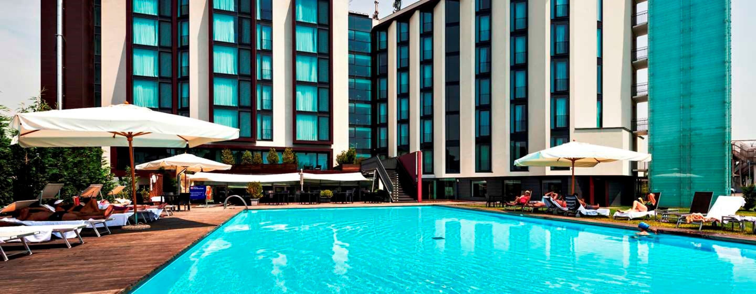 seasonal outdoor pool, open 8:00 am to 7:00 pm, pool umbrellas