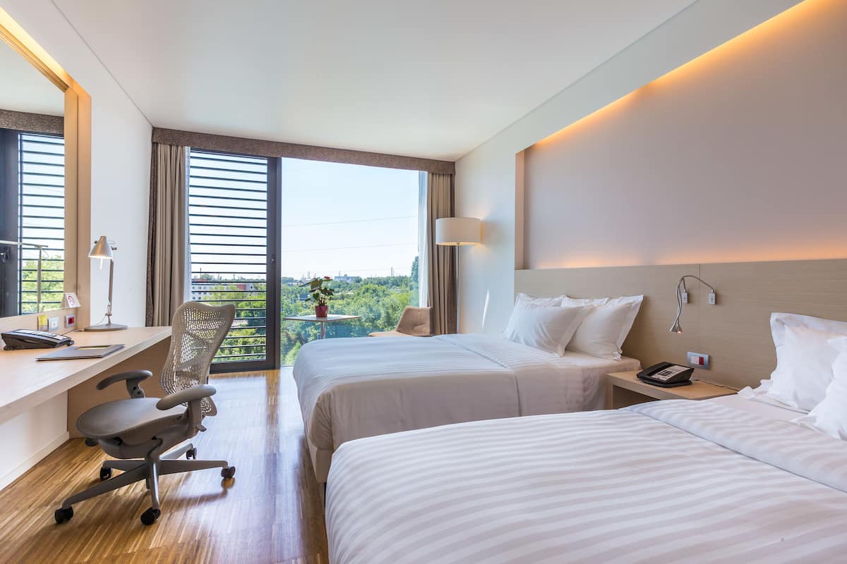 superior room, 2 queen beds | premium bedding, down duvets, in-room safe, desk