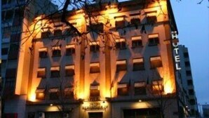 A hotel with a prominent 'HOTEL' sign on the facade, multiple floors, and a visible entrance with a canopy. - Ramón Berenguer IV (Lleida)