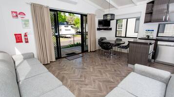 Deluxe Two Bedroom Villa | Living area | TV, DVD player