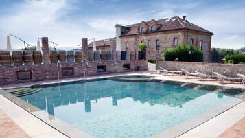 Indoor pool, outdoor pool, pool umbrellas, pool loungers