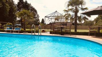 Outdoor pool, pool umbrellas, sun loungers