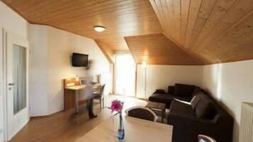 Grand Apartment | Living area | Flat-screen TV
