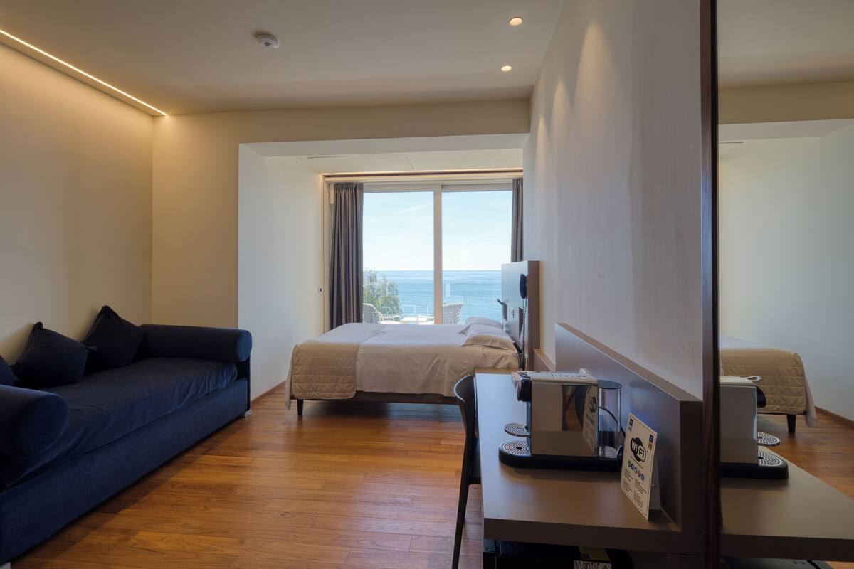 Superior Triple Room | Minibar, in-room safe, desk, soundproofing