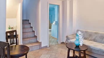 Honeymoon Suite, Sea View | Living area | TV