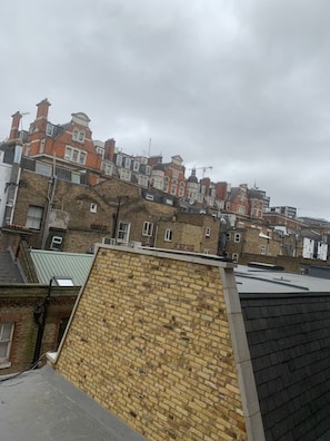 A row of terraced houses with brick facades and pitched roofs.