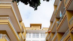 A multi-story building with balconies, a central entrance gate, and the name "Bambi" on the facade. - RF Apartamentos Bambi - Adults Only (Puerto de la Cruz)