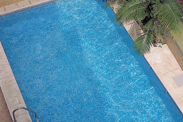 Outdoor pool, pool umbrellas, sun loungers