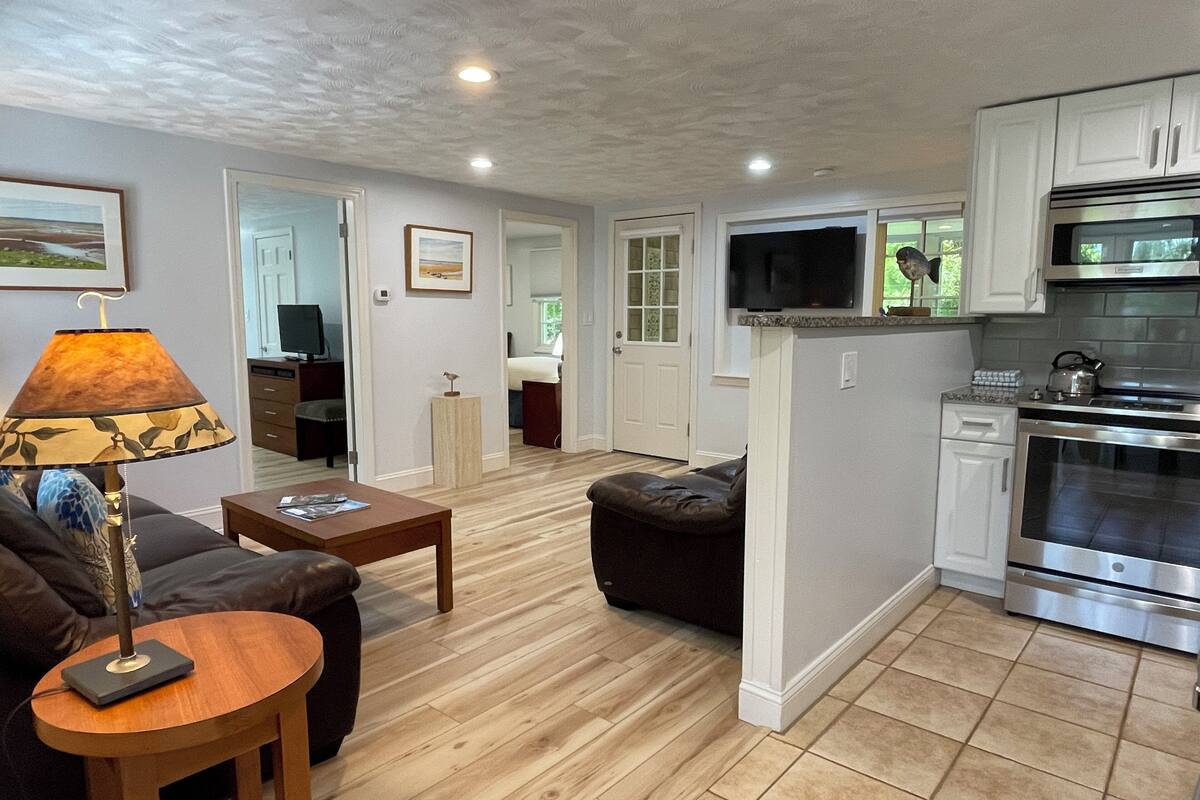 lower deluxe two bedroom cottage | living area | flat-screen tv, dvd player