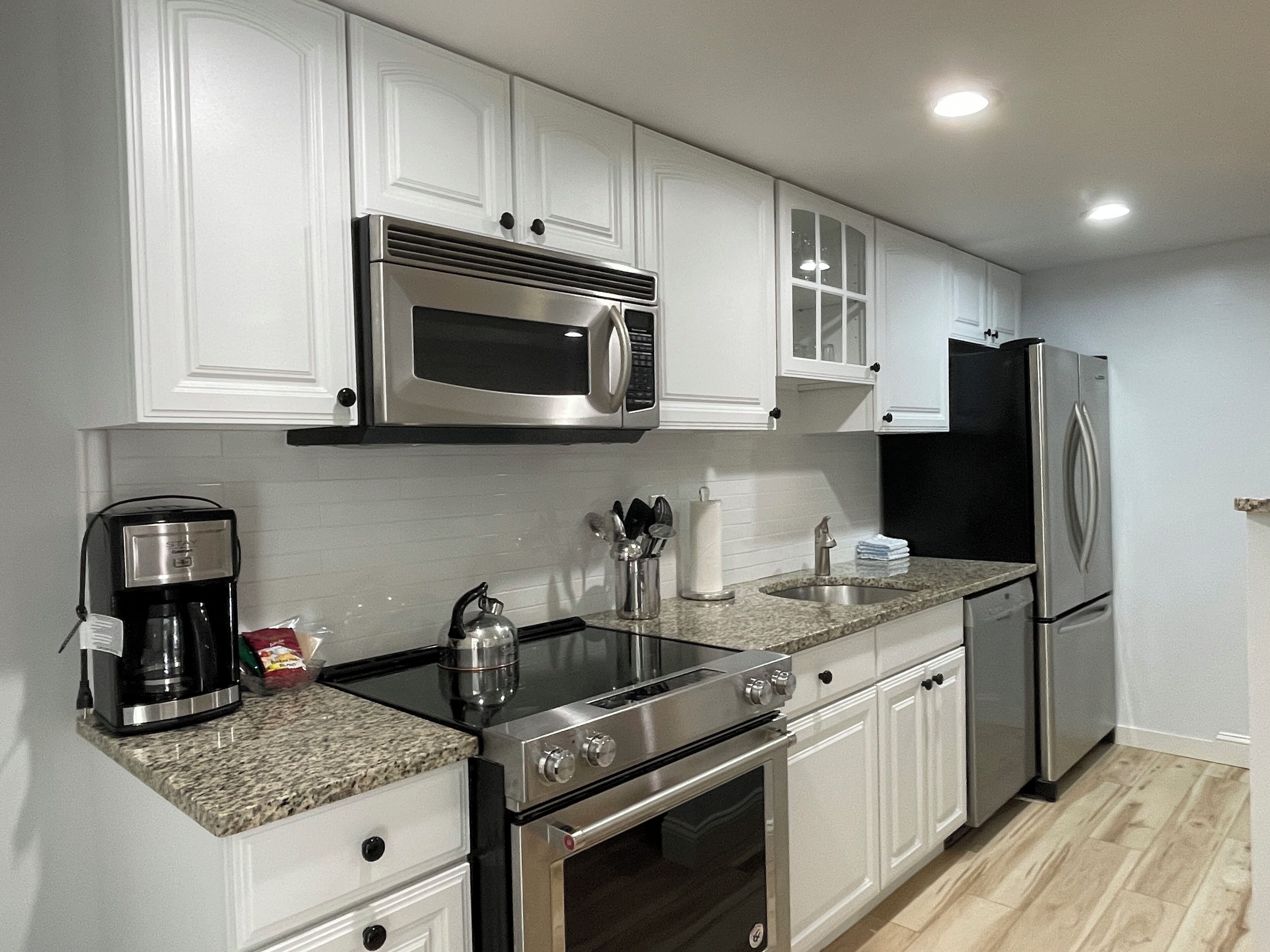 upper deluxe two bedroom cottage | private kitchen | fridge, coffee/tea maker