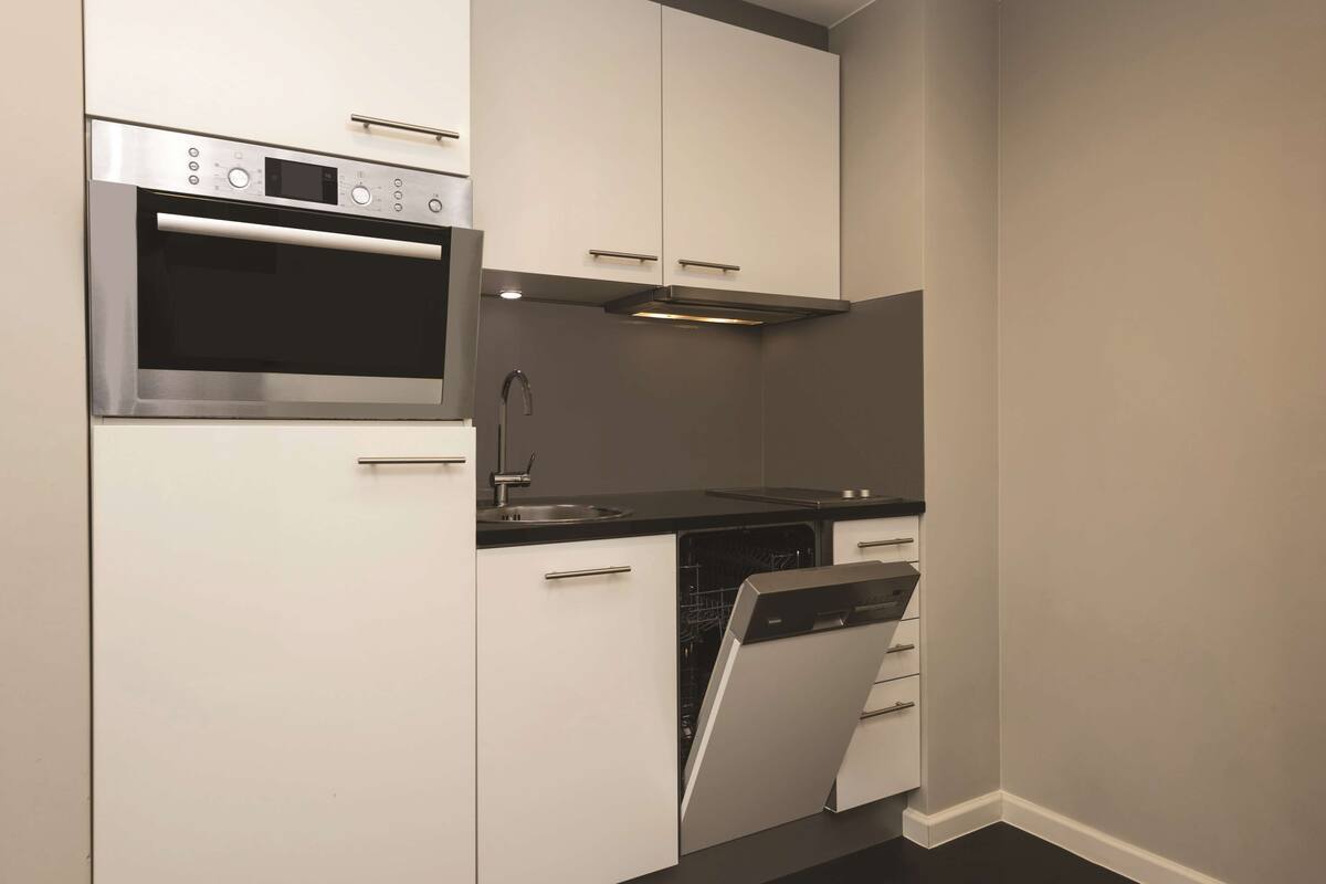 full-sized fridge, microwave, stovetop, dishwasher