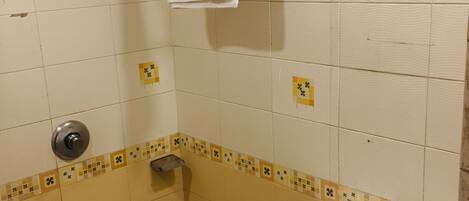 A small bathroom with a toilet, sink, and towel rack.