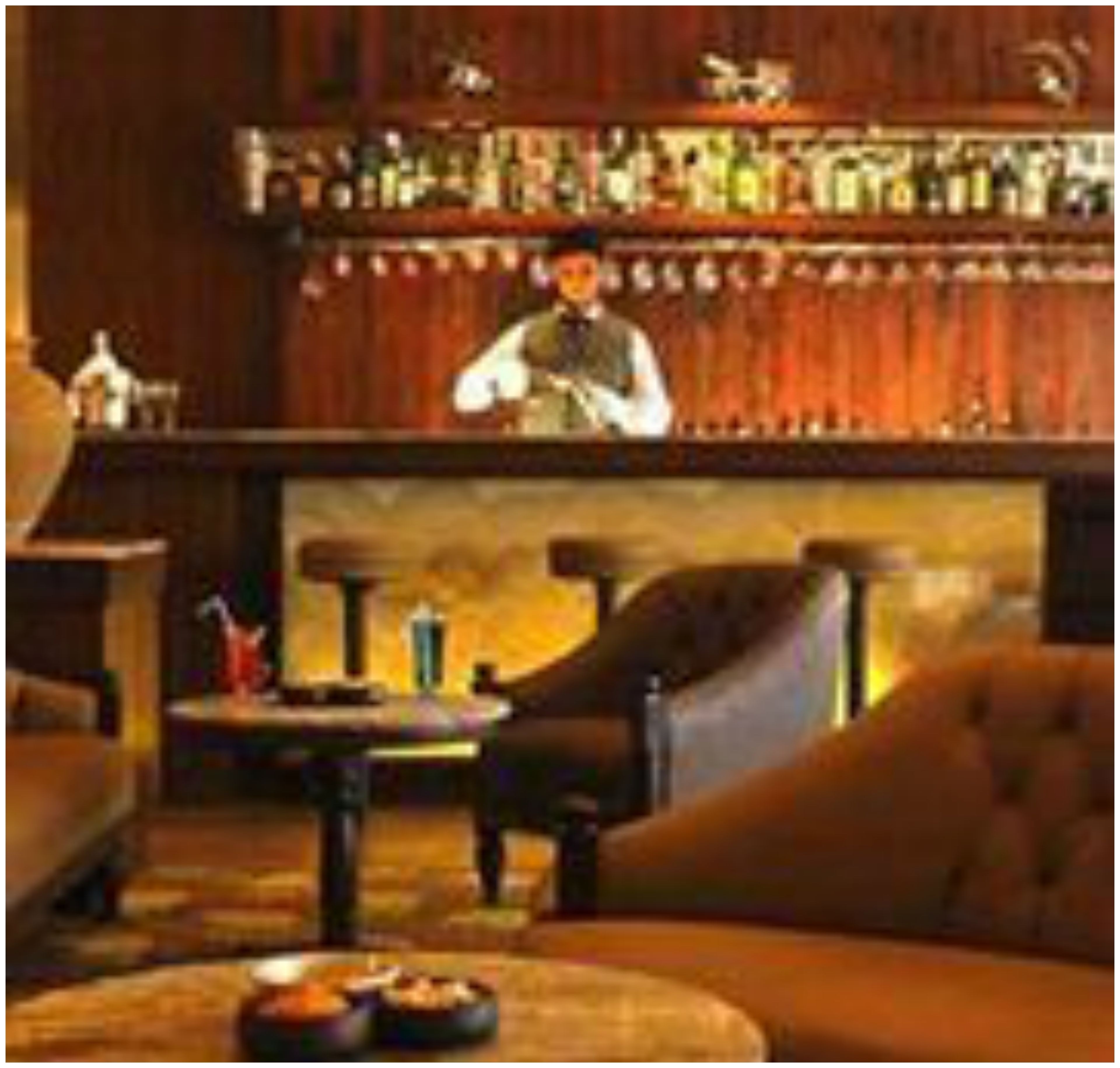 A bar area with a bartender, wooden bar counter, and seating.
