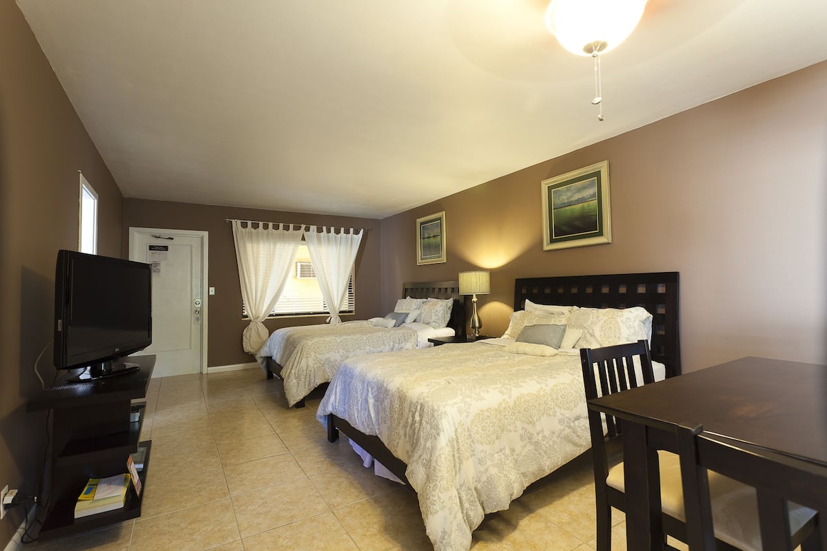 Standard Room, 1 Bedroom, Non Smoking (Double Queen- 9) | Iron/ironing board, WiFi (free), individually decorated