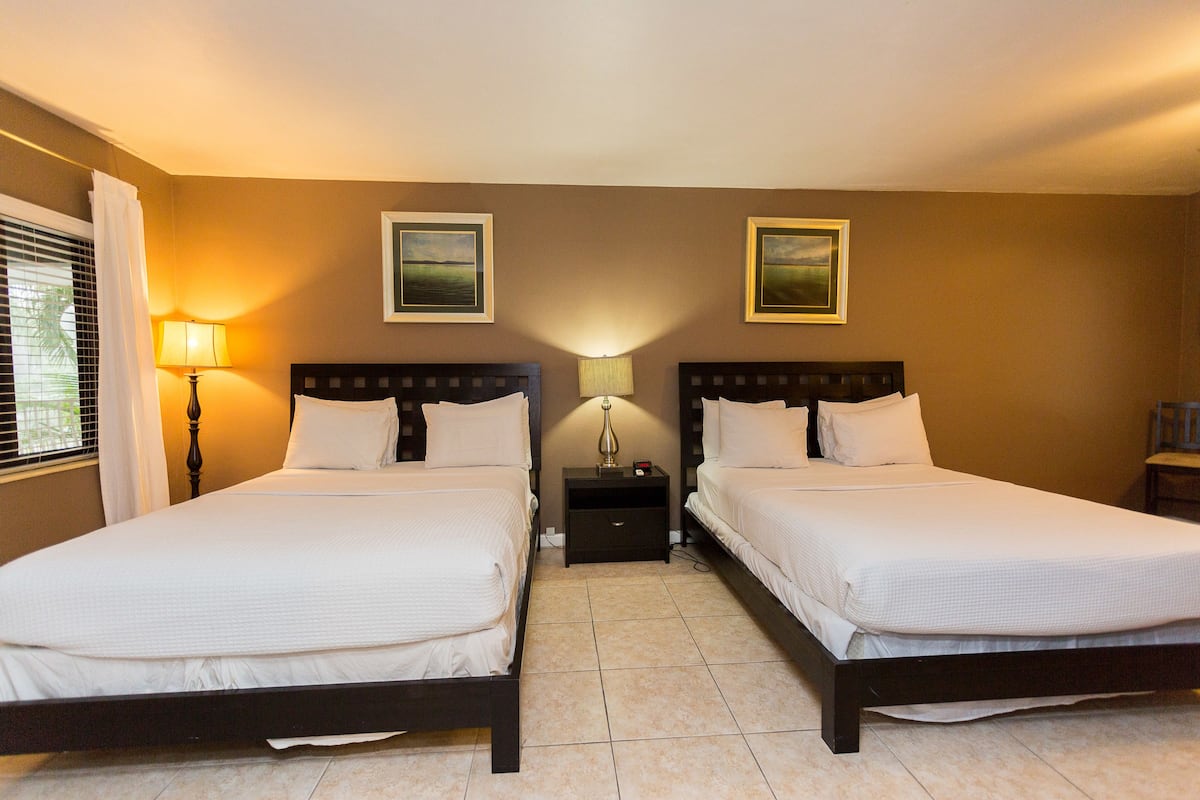 Standard Room, 1 Bedroom, Non Smoking (Double Queen- 3) | Iron/ironing board, WiFi (free), individually decorated