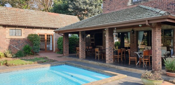 Outdoor pool, open 9:30 AM to 6:00 PM, pool loungers