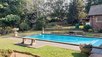 Outdoor pool, open 9:30 AM to 6:00 PM, pool loungers