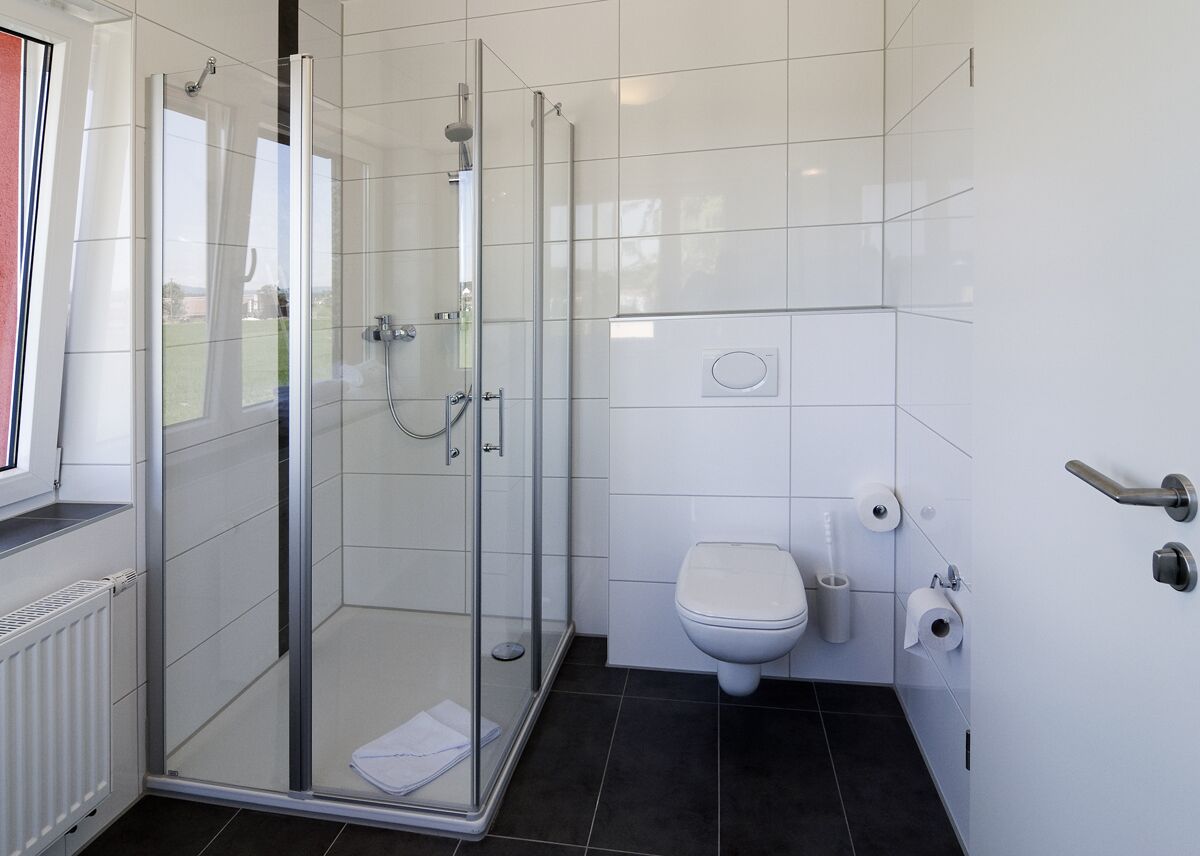 deluxe double room, balcony, lake view | bathroom | hair dryer, bathrobes, slippers, towels