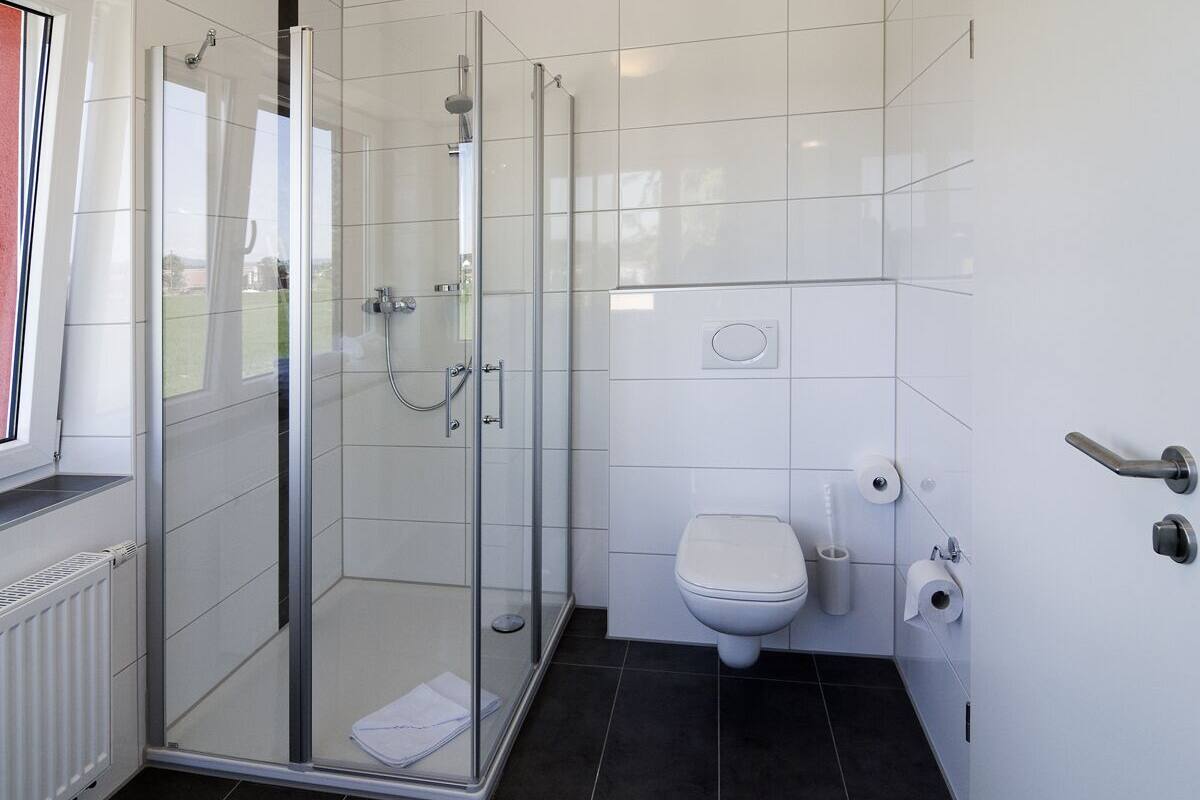 deluxe double room, balcony, lake view | bathroom | hair dryer, bathrobes, slippers, towels