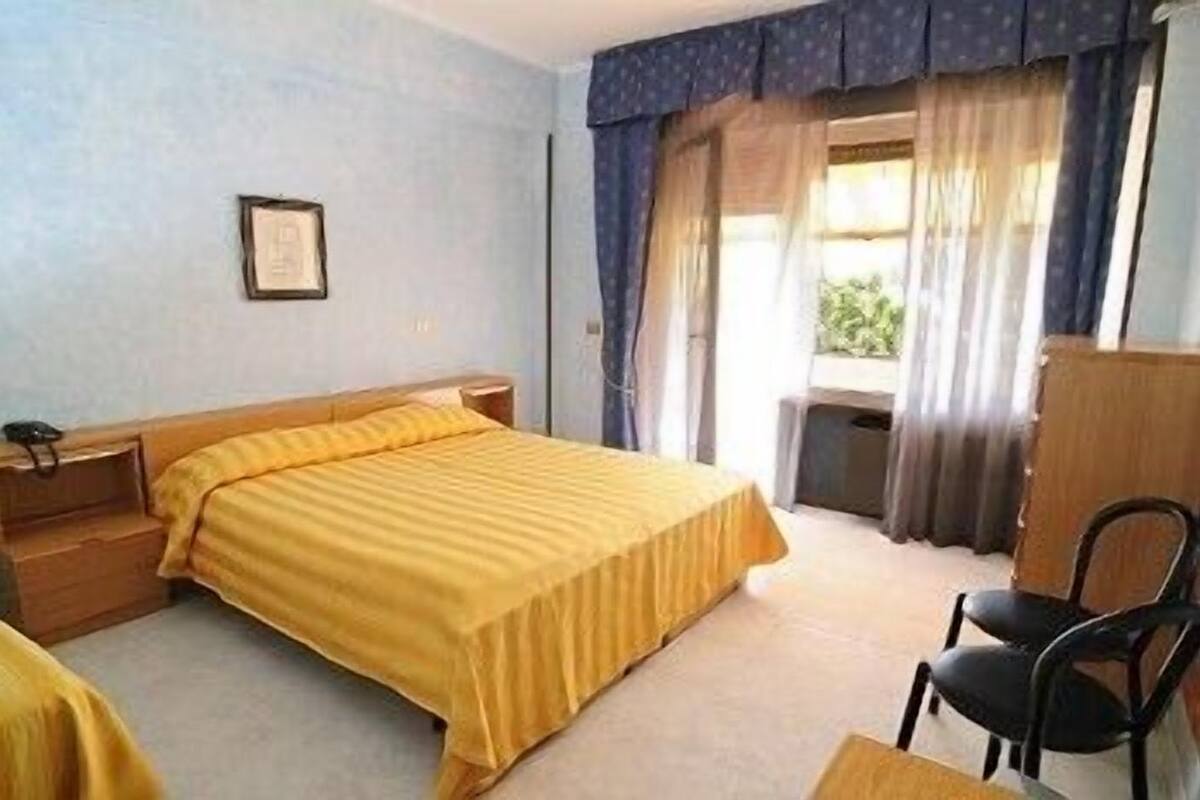 Quadruple Room | Minibar, desk, iron/ironing board (on request), WiFi (free)