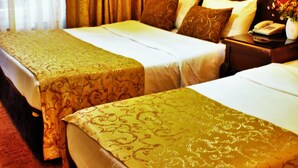 A hotel room with two beds, a nightstand with a phone and vase, and a large window with curtains. - Sultanahmet Park Hotel (Istanbul)