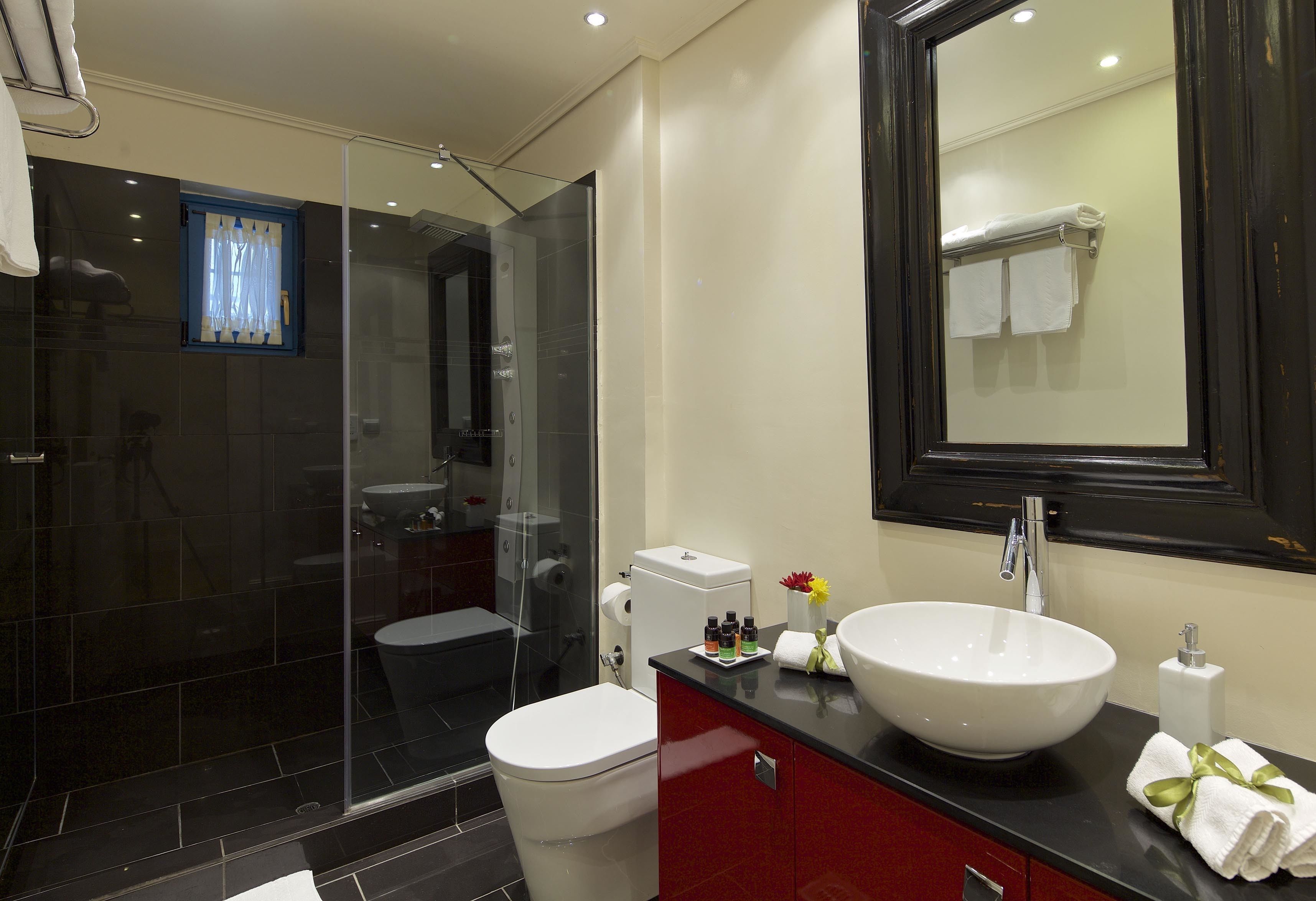 Deluxe Suite, 1 King Bed with Sofa bed | Bathroom | Shower, rainfall showerhead, designer toiletries, hair dryer