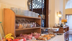 A buffet setup with various food items and utensils. - Sunset Hotel Corfu (Corfu)