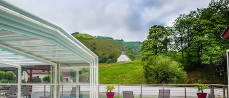 Seasonal outdoor pool, open 10:00 AM to 7:00 PM, pool umbrellas