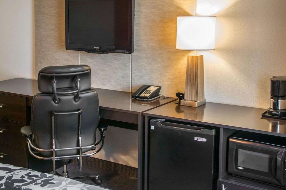 desk, blackout curtains, iron/ironing board, rollaway beds