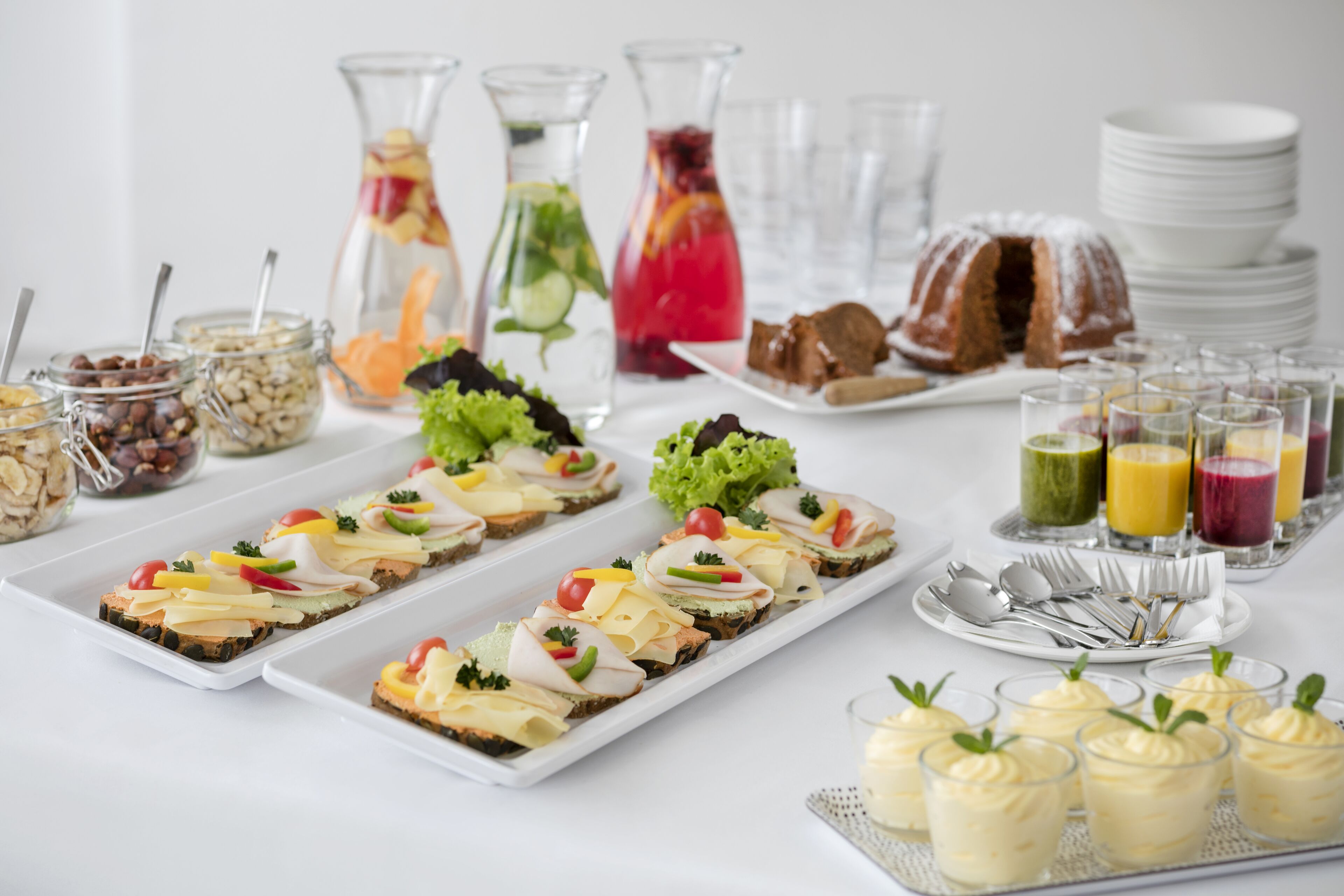 A buffet with various food items and beverages.