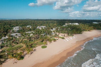 On the beach, beach cabanas, sun loungers, beach umbrellas at The St. Regis Bahia Beach Resort, Puerto Rico