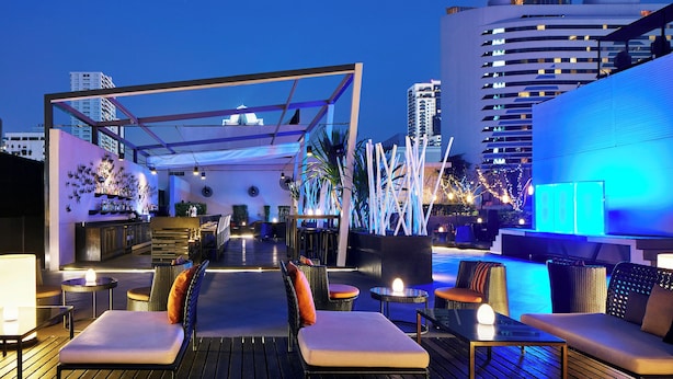 A rooftop bar with outdoor seating, a pool, and city views. - Paradox Bangkok Sukhumvit (Bangkok)