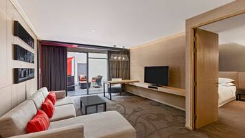 Suite, 1 King Bed, Terrace | Living area | 32-inch LCD TV with satellite channels, TV, DVD player