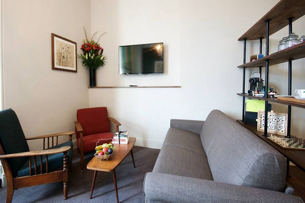 family room | hypo-allergenic bedding, desk, iron/ironing board, free wifi