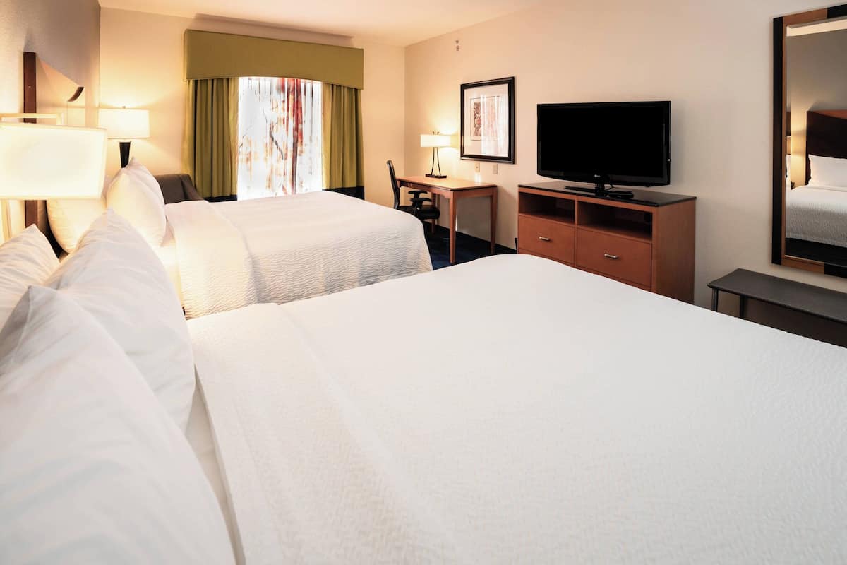 room, 2 queen beds | in-room safe, iron/ironing board, travel cot, free wifi
