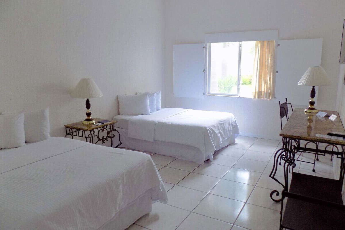 Premium bedding, blackout curtains, iron/ironing board, free WiFi