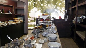 A buffet setup with various food items and serving utensils. - Bolgheri Marina Resort ex Varo Village (Bibbona)