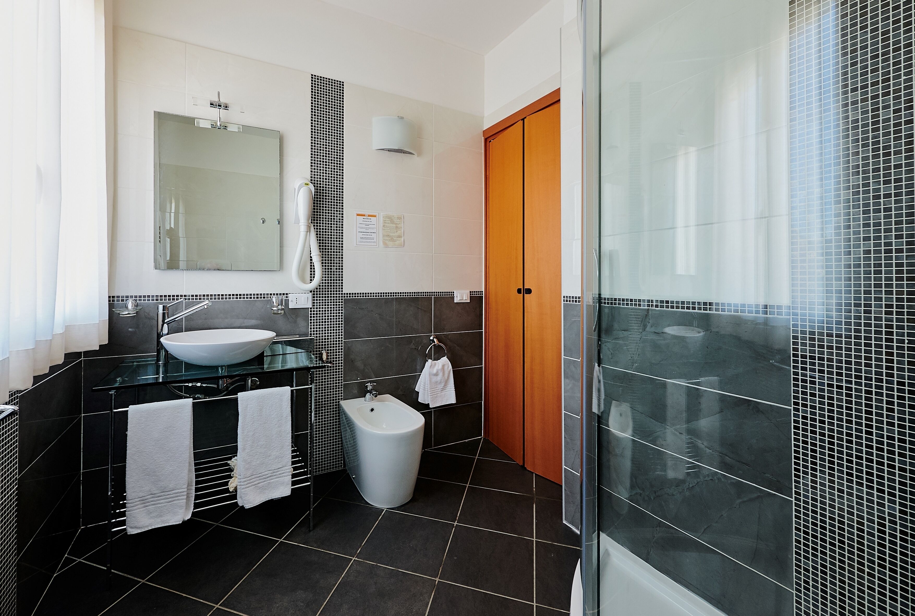 junior studio suite | bathroom | free toiletries, hair dryer, bidet, towels