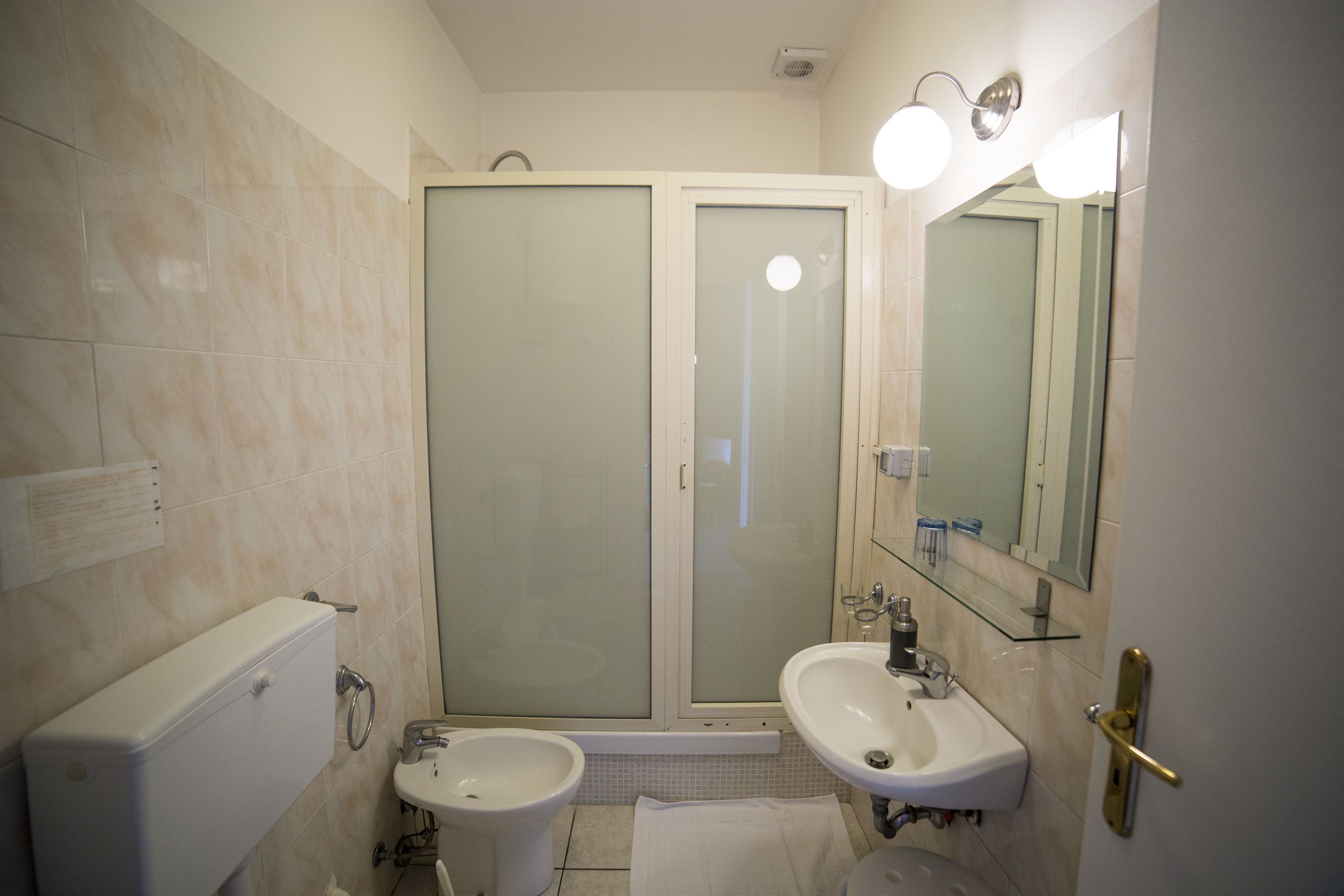 quadruple room | bathroom | shower, free toiletries, hair dryer, slippers
