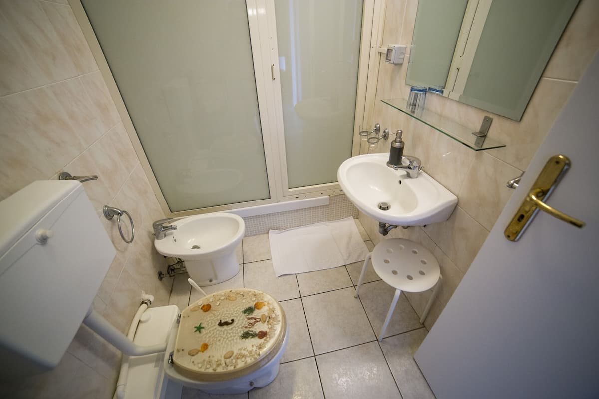 double room with external private bathroom  | bathroom | shower, free toiletries, hair dryer, slippers
