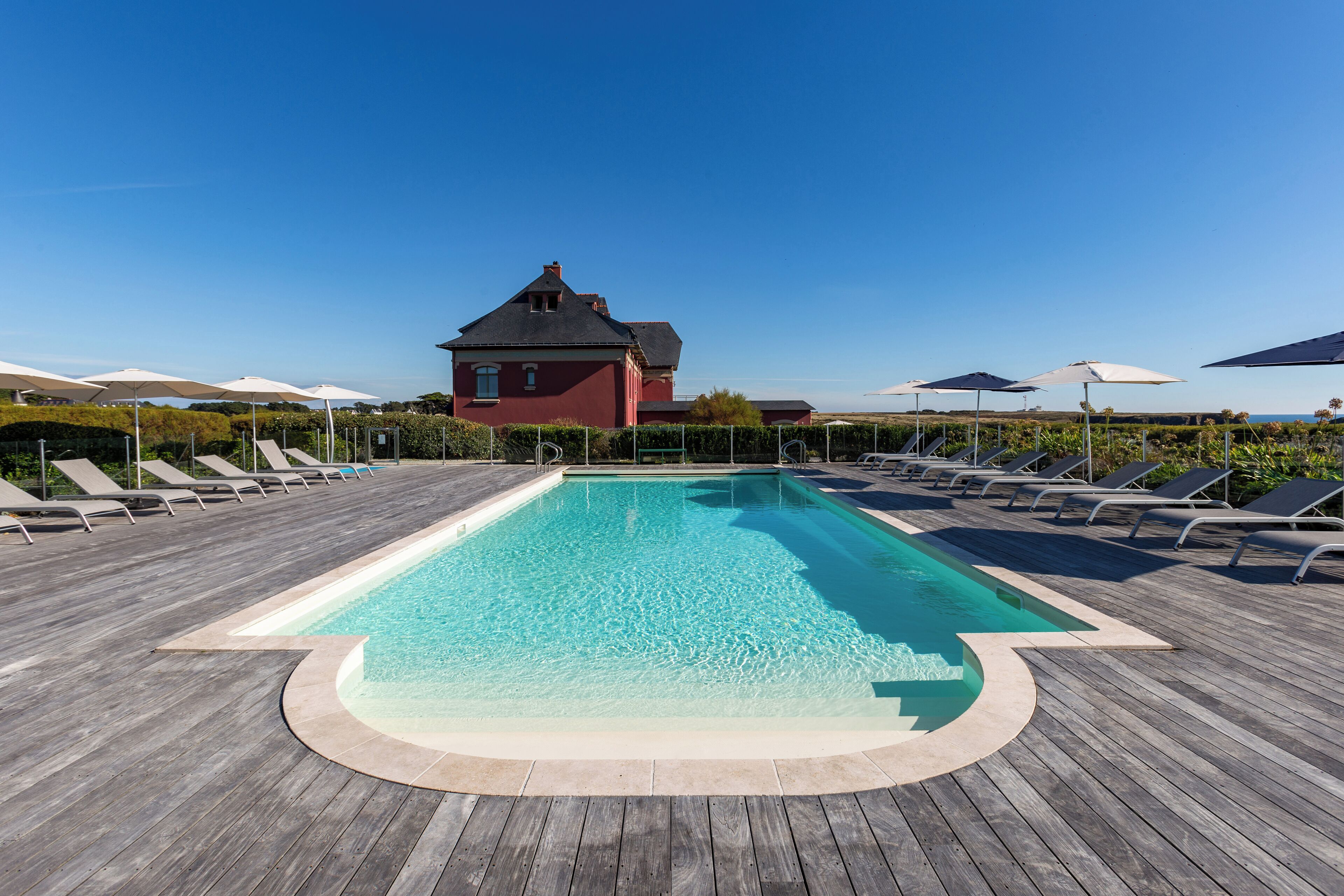 seasonal outdoor pool, open 9 am to 9 pm, pool umbrellas, pool loungers