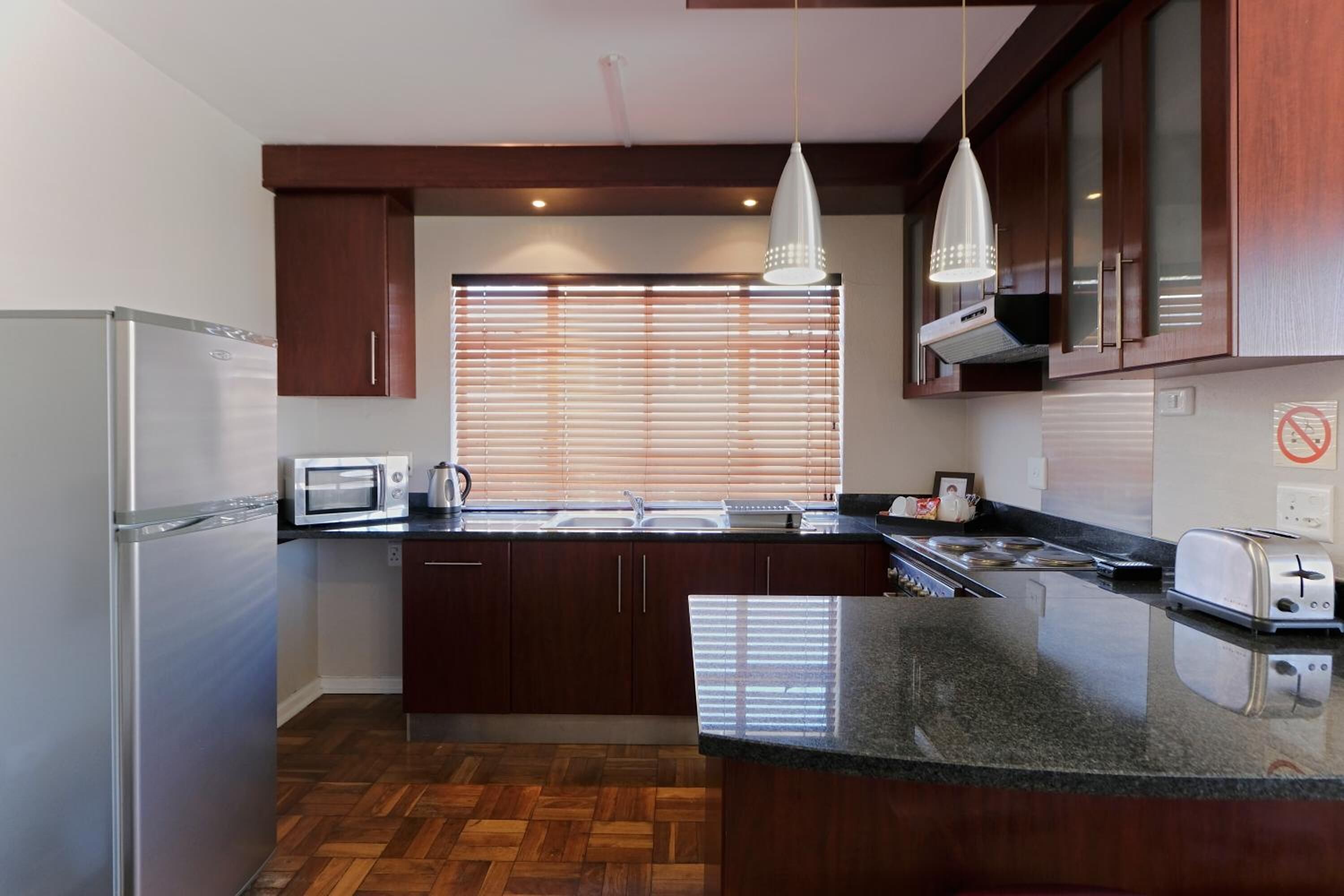 Full-size fridge, microwave, stovetop, cookware/dishes/utensils