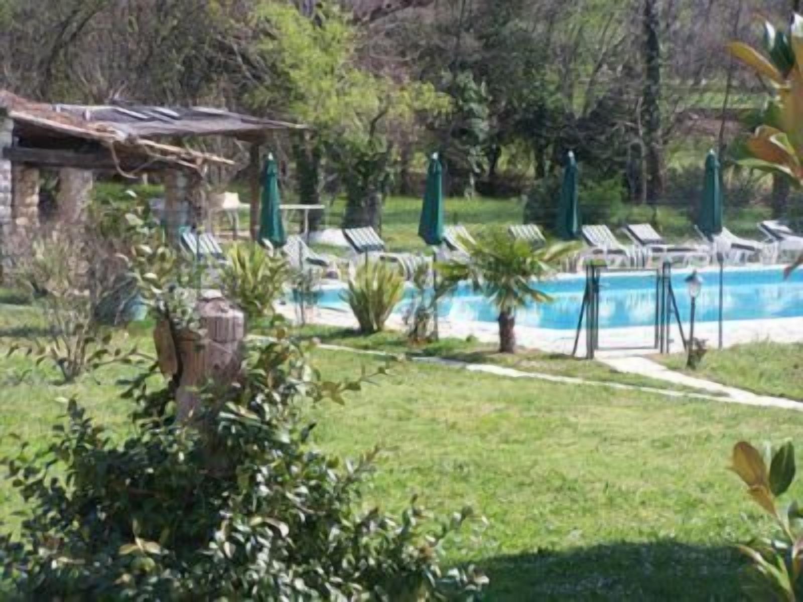 seasonal outdoor pool, pool umbrellas, pool loungers