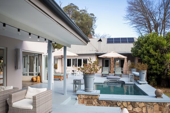 Outdoor pool, pool umbrellas, pool loungers