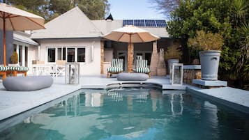 Outdoor pool, pool umbrellas, pool loungers