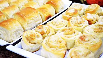 A tray of freshly baked rolls and cinnamon rolls.