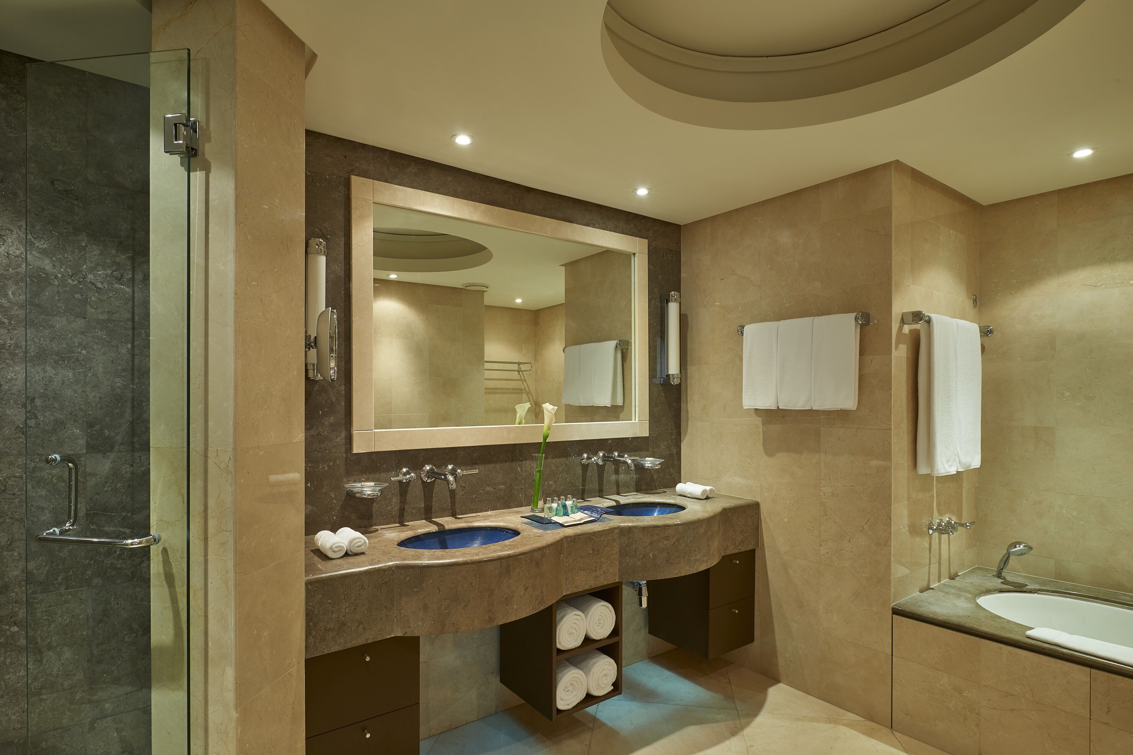 separate bathtub and shower, deep-soaking bathtub, designer toiletries