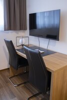 Desk, blackout drapes, soundproofing, iron/ironing board