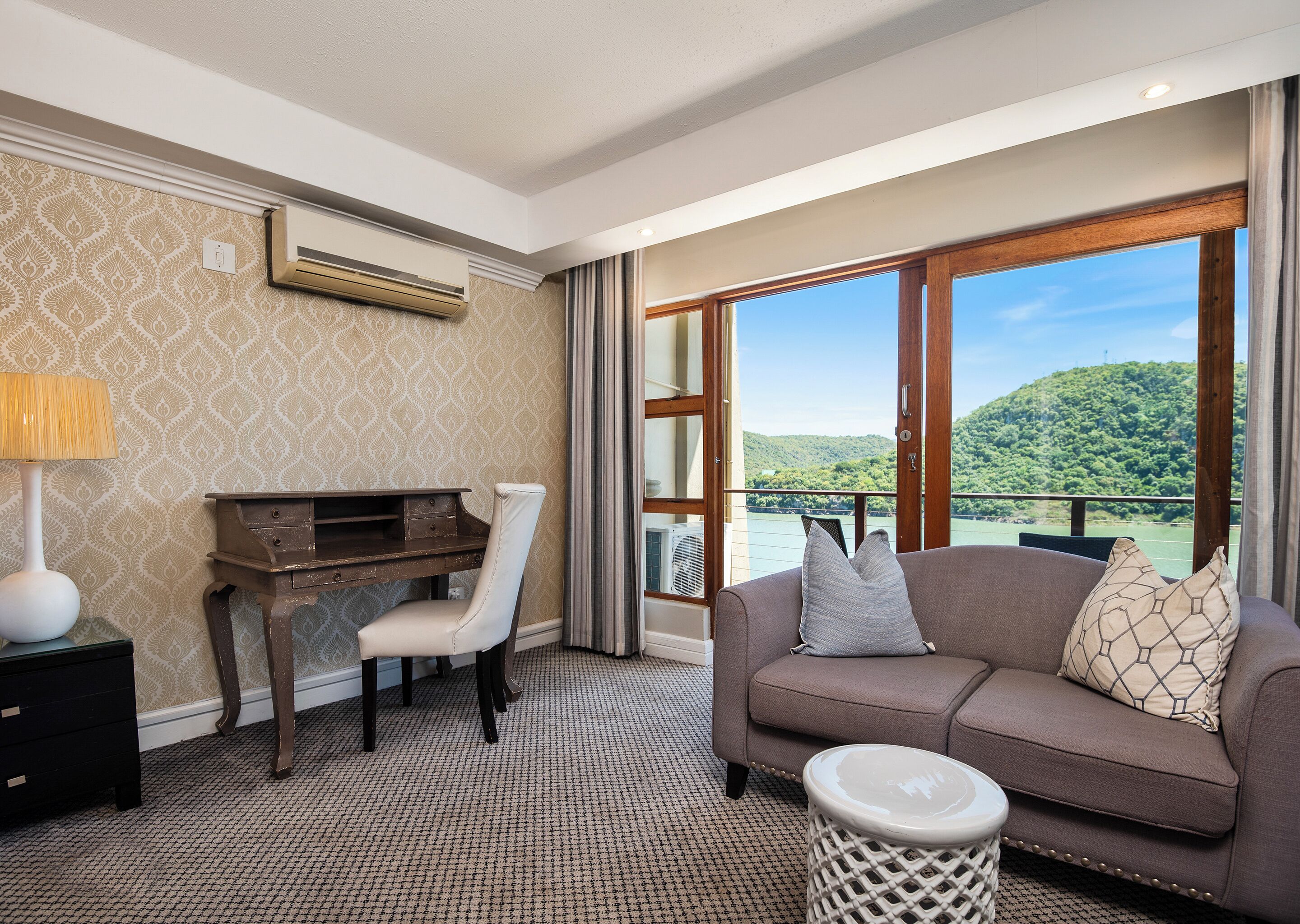 deluxe room | living area | 72-cm plasma tv with satellite channels, tv